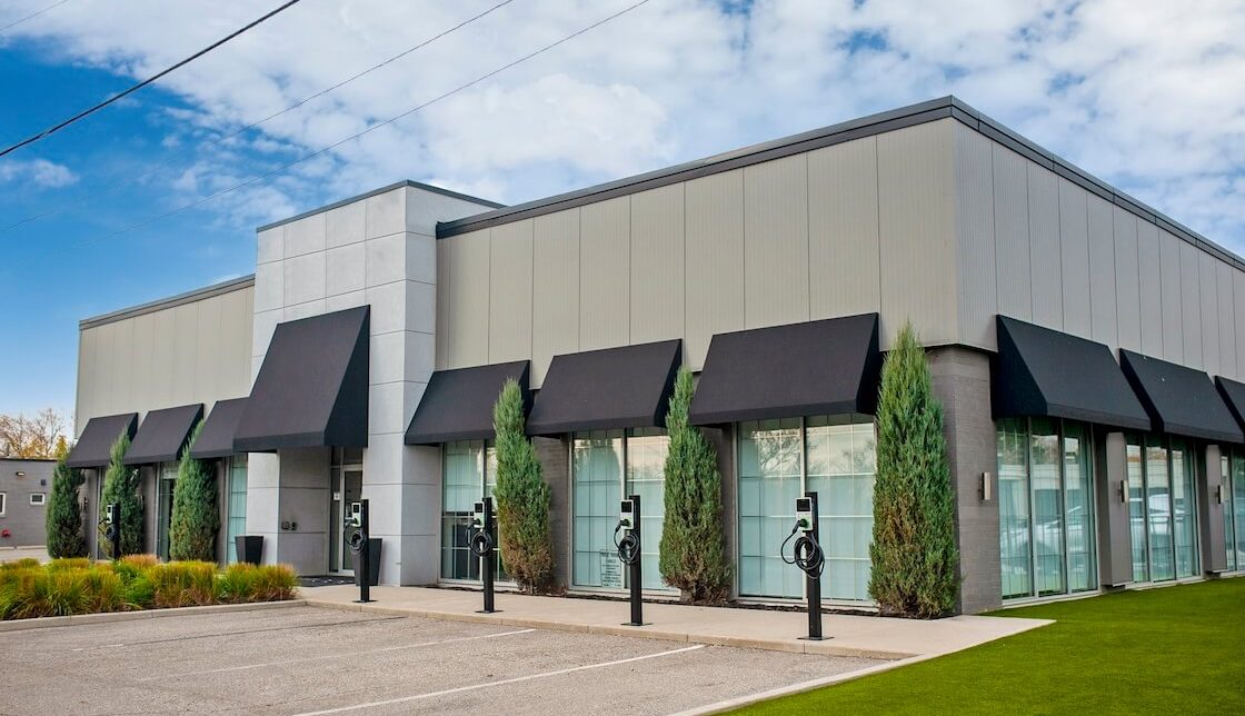 Demonstrates what commercial EV charging can look like outside a small business